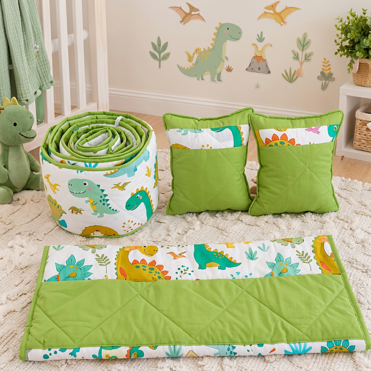 Set de cuna con estampado de dinosaurios y almohadas verdes